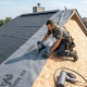 Professional roofing contractor installing roof underlayment to protect a home from hidden water damage and improve long-term roof performance.